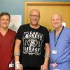 (L-R) Jonny Ritchie, Physiotherapist; Christopher Bennett and Matthew Wilson, Consultant Orthopaedic Surgeon.