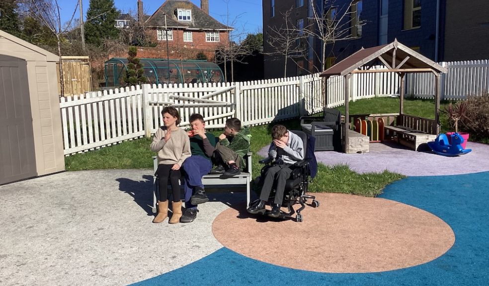 Students in the current unstimulating play space at the Deaf Academy