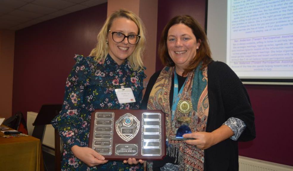 Sarah Routley receiving her award from Amy Gilbert-Jeans, Housing Service Lead