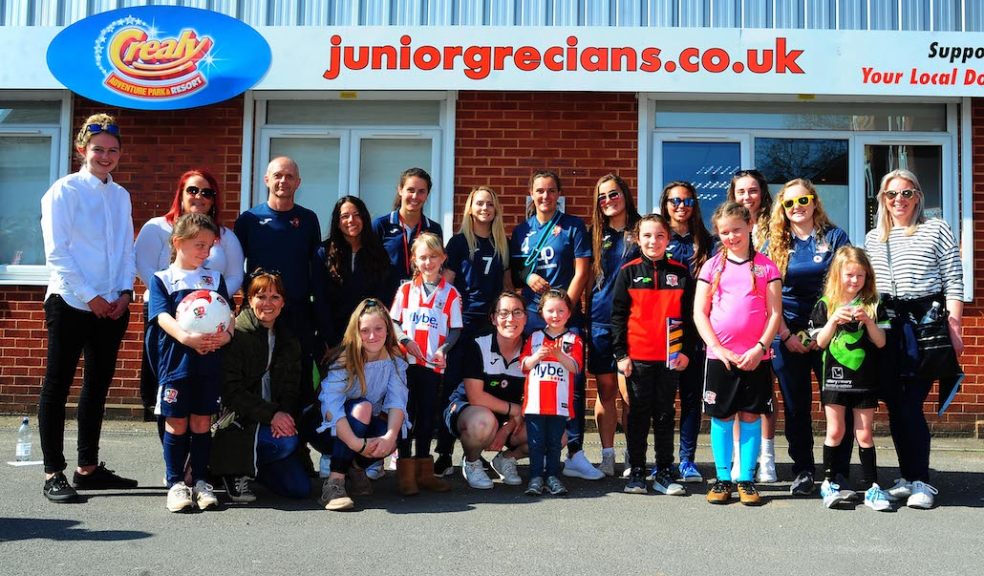 Female supporters and players outside Exeter City's Junior Grecians Zone