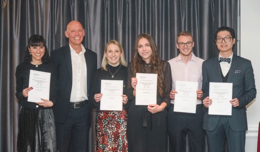 Group of students with certificates