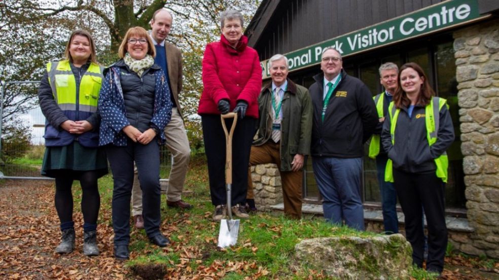  DNPA Chair Pamela Woods carrying out the turf-cutting. L-R: NPS South West Project Manager Claire Walkey, DNPA’s Head of Communications and Fundraising Sam Hill, Duchy of Cornwall’s Land Agent Tom Stratton, DNPA Chair Pamela Woods, DNPA Member Andrew Cooper, DNPA Member Mark Renders, Fifield Construction’s Contracts Manager Sheri Noad, Fifield Construction’s Site Manager David Indge.  