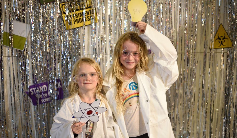 Two children take part in a science event