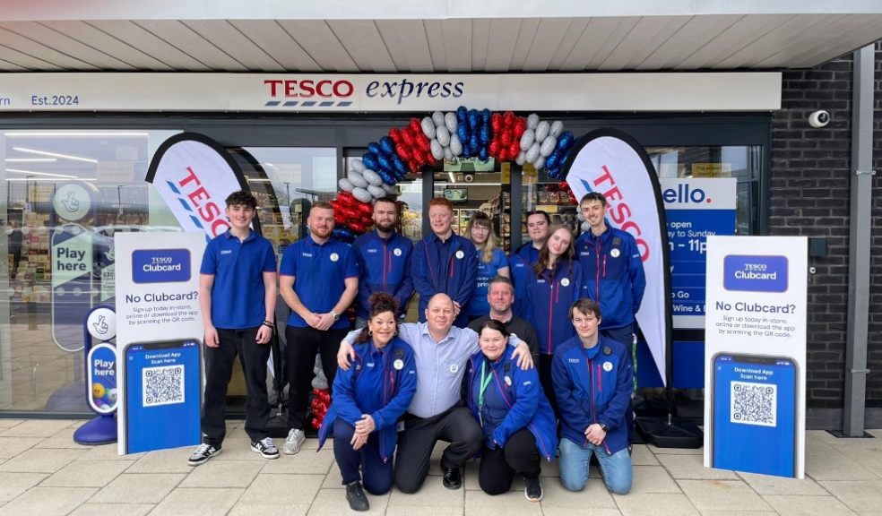 group of men and women outside Tesco supermarket in Exeter