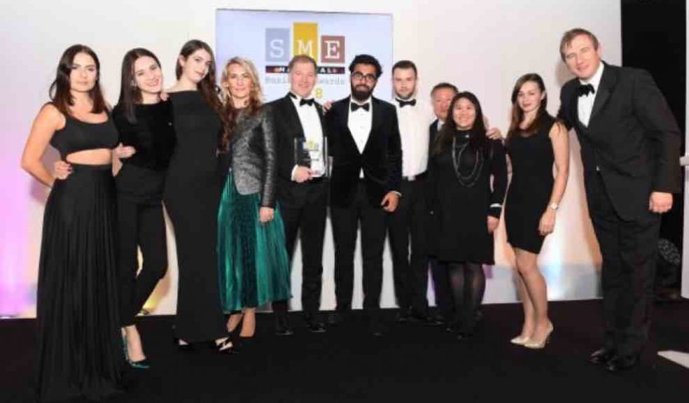 Layla Anna-Lee (MC), VHR (Business of the Year More Than 50 Employees and Overall Winner) and Brendan Brien (Clydesdale Bank) onstage at the SME National Business Awards 2019 at Wembley Stadium, London]