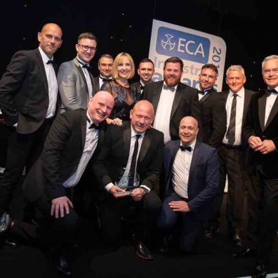 MD Nathan Evans (front row centre) and staff from Clarkson Evans alongside TV presenter Hugh Edwards.