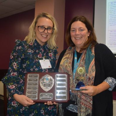 Sarah Routley receiving her award from Amy Gilbert-Jeans, Housing Service Lead