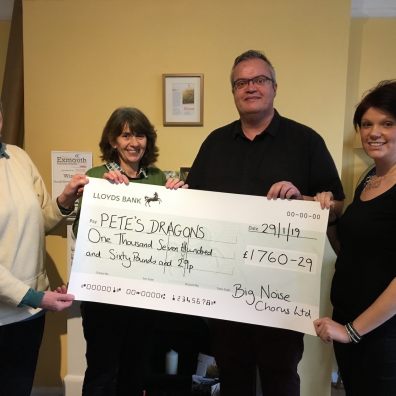 (l-r) Prue Tasman, Judy Day and Colin Rea of the Big Noise Chorus present a cheque for £1,760 to Pete’s Dragons Project Manager Kate Bedding. 