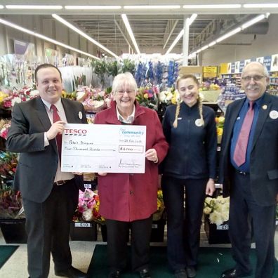 Dan Salisbury, customer service manager at the Exeter Vale Tesco Extra, presents a cheque for £4,000 to Pete’s Dragons chair of trustees Janet Ash. Also pictured are Tesco’s Marta Marsweska and John Smith.