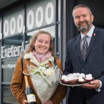 Exeter Airport managing director Matt Roach with millionth passenger Lily Harris.