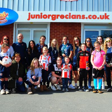 Female supporters and players outside Exeter City's Junior Grecians Zone