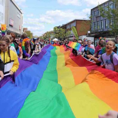 One of the two rainbow flags making their way towards Exeter High Street. Photo: Alan Quick