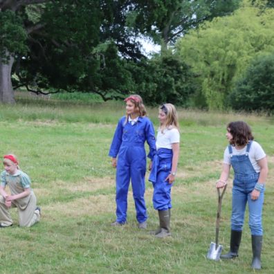 Children dressed as Land Girls in the grounds of Killerton House