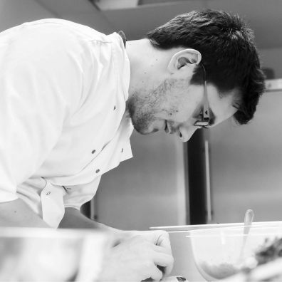 Worker in Paramount kitchen preparing food